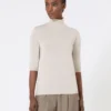 Stockinette-stitched wool polo-neck sweater, powder
