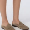 Suede mules, mud